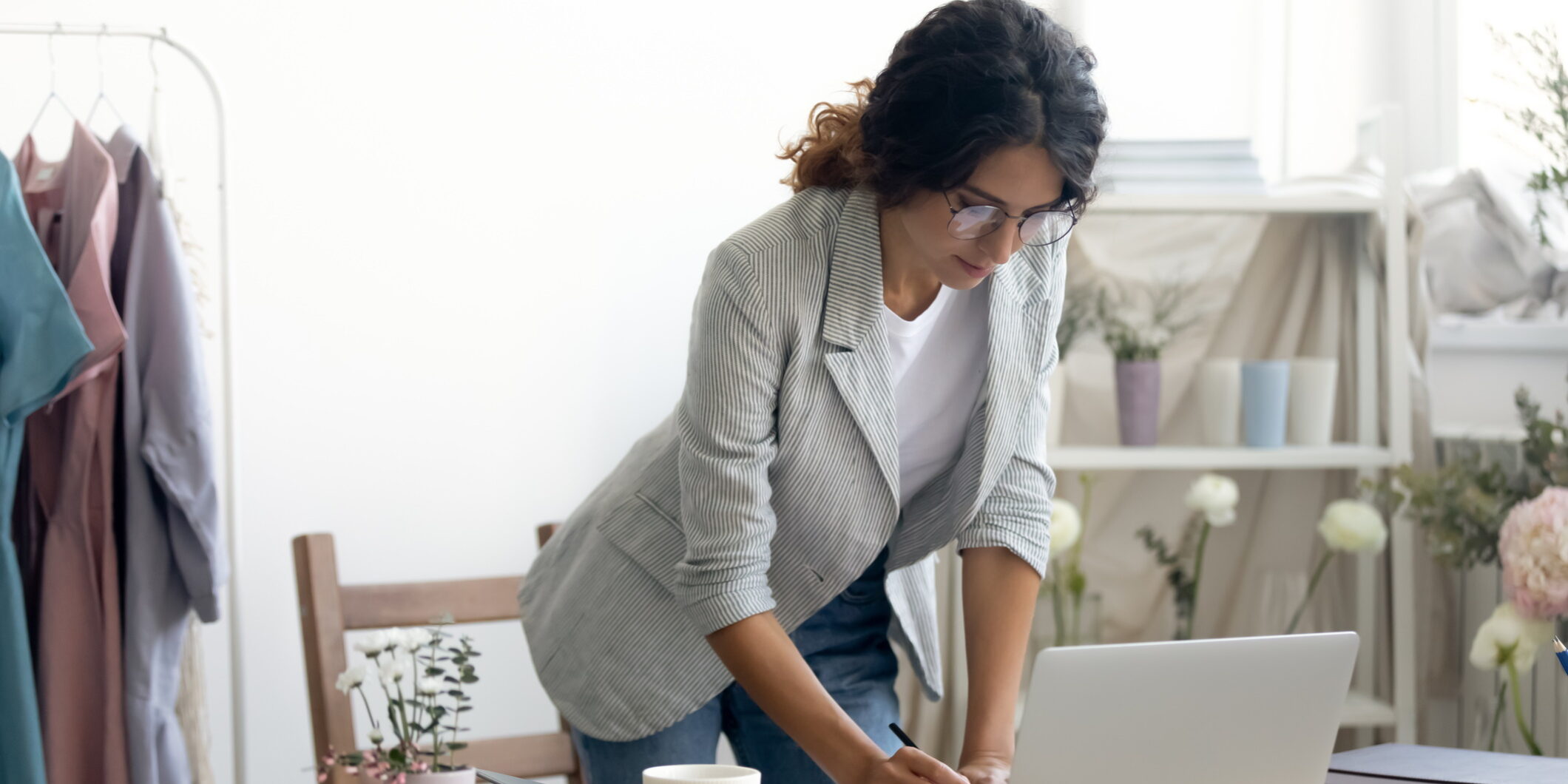 Photo of a small business owner reviewing her website